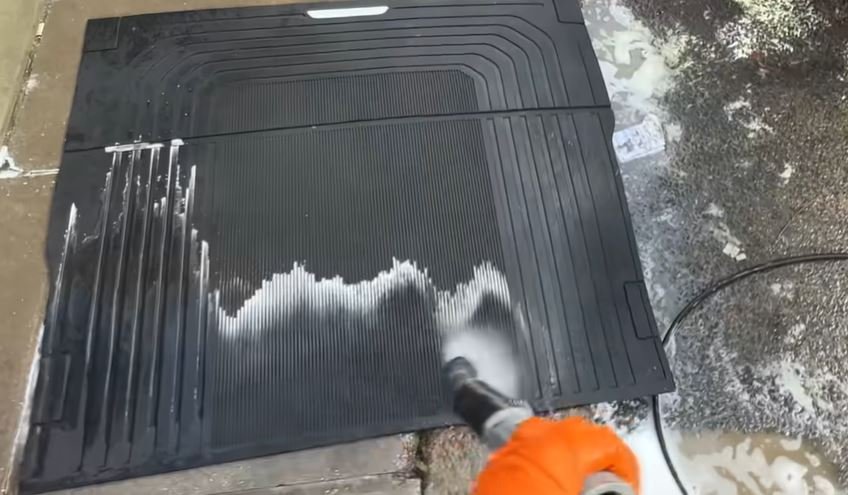 Pressure rinse removing salt film before a hand wash during an Alameda mobile car detail
