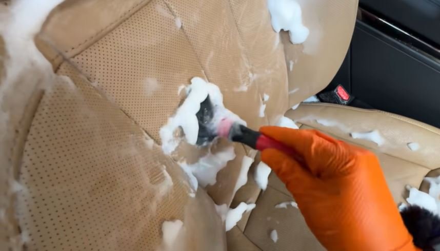 Hot water extraction on a car seat during an interior restoration detail in Oakland
