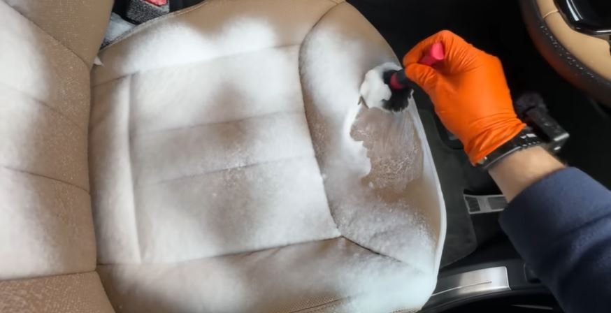 Seat extraction and deep cleaning during an interior restoration detail in Oakland