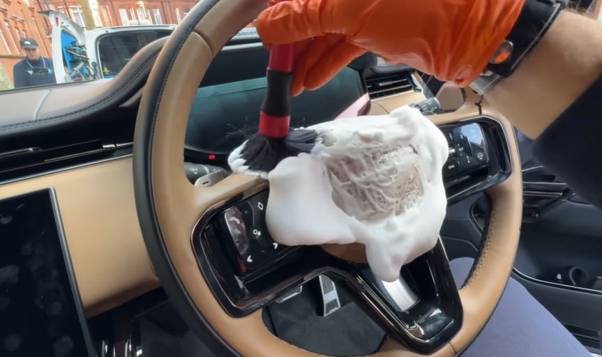 Steering wheel and interior controls being cleaned during a Berkeley interior car detail