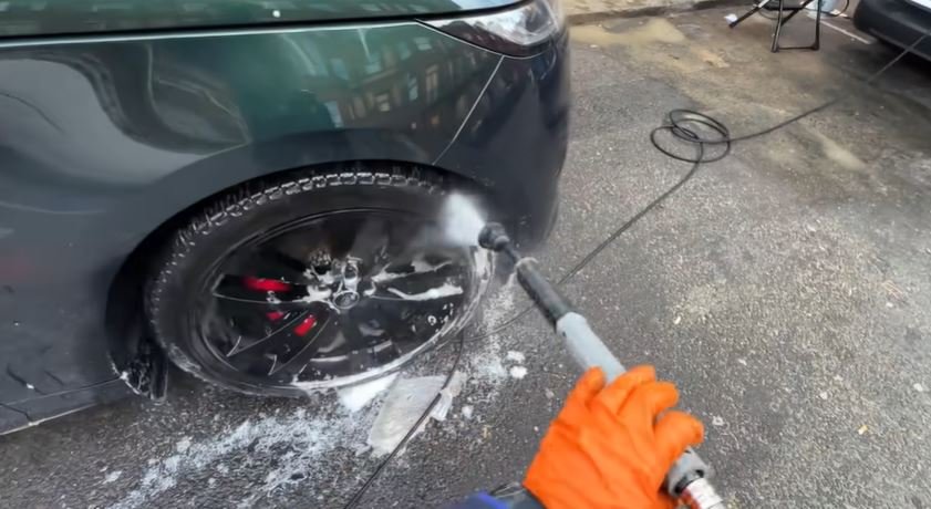 Mobile auto detailing van running its own water and power supply during a curbside appointment in Oakland