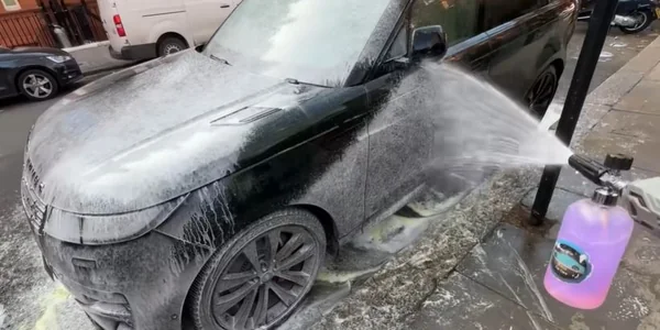Applying a decontamination chemical to car paint in Oakland