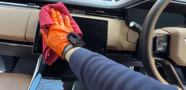 Cleaning a windshield during a mobile detail
